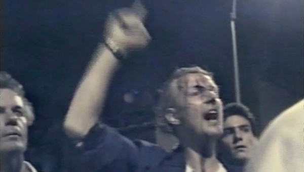 On August 6, 1988, New York City police attempted to enforce a curfew during a rally held at Tompkins Square Park. The police violently broke up the rally; videographer and artist Clayton Patterson filmed the event on his VHS camcorder. His footage captured multiple incidents of police brutality, leading to the indictment of six police officers. Patterson later appeared on Oprah, held up his camcorder, and declared, “This is a revolutionary tool. Little Brother is watching Big Brother.” New York City, 1988, courtesy of Clayton Patterson.