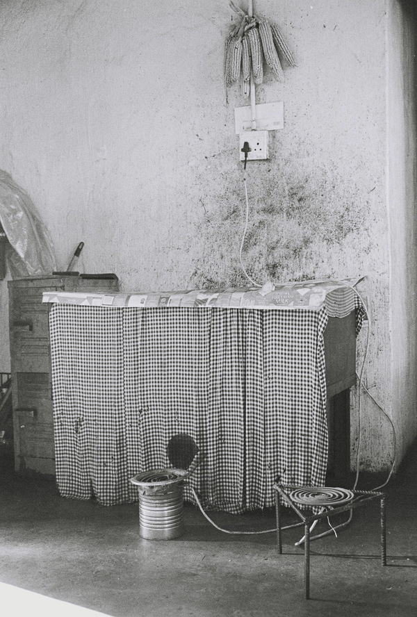 Andrew Tshabangu, Mielies, Stove and Heater, from the series Hostel Interiors, 2011 Courtesy the artist and Gallery MOMO