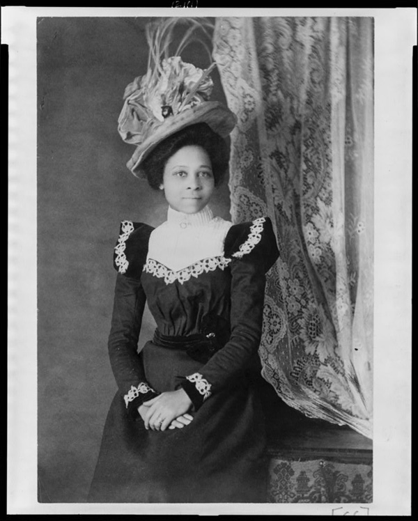 Young African American woman, three-quarter length portrait, facing slightly right, with hands folded on her lap, from African American Photographs Assembled for 1900 Paris Exposition. Library of Congress Prints and Photographs Division Washington, D.C.