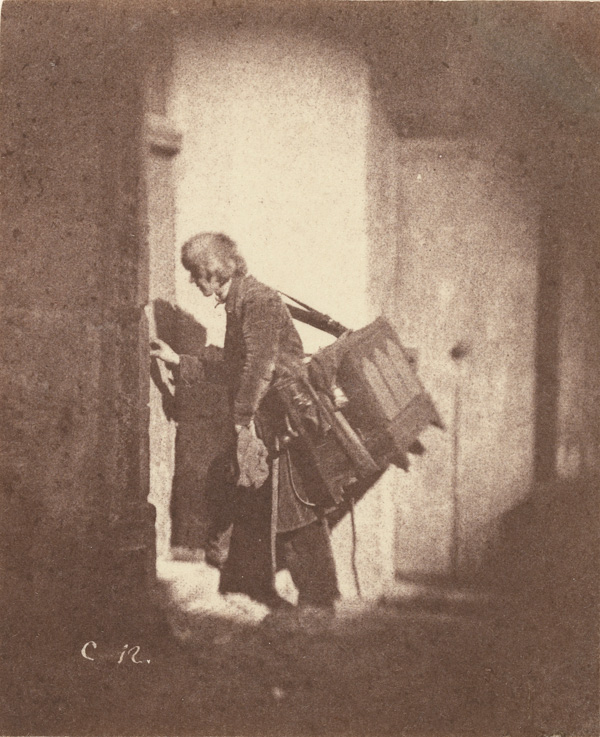 Charles Nègre, Organ Grinder at 21, quai Bourbon, Ile Saint-Louis, Paris, ca. 1853. Salted paper print from a paper negative. Courtesy The J. Paul Getty Museum, Los Angeles