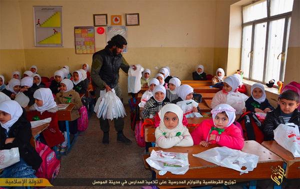 ISIS distributes school supplies to girls in Mosul, Iraq, 2015. Video still