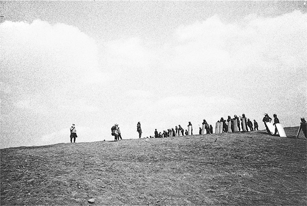 Kazuo Kitai, Women Facing the Police on a Hilltop, 1971, from the series Sanrizuka, 1969-72 © the artist 