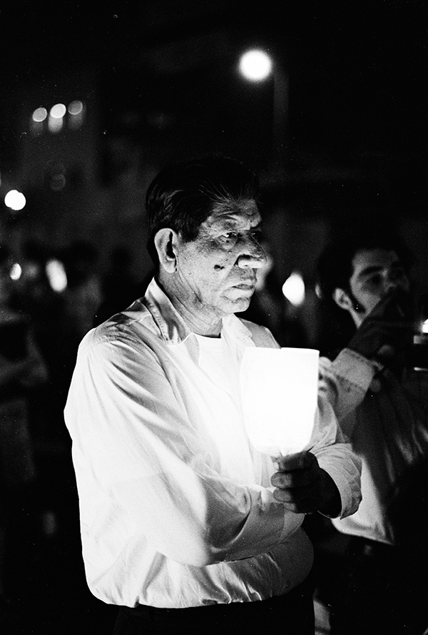 Manuel G. Barrera Jr , Evening vigil at LAPD Parker Center, ca. 1971. © the artist and courtesy the UCLA Chicano Studies Research Center 