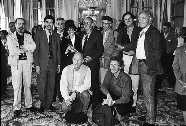 Presentation of the Commandeur des Arts et Lettres medal to Robert Delpire. From left to right (standing): unidentified man; French Minister of Culture Philippe Douste-Blazy; Elliott Erwitt; Sarah Moon; Robert Delpire; René Burri; Bruno Barbey; William Klein; (squatting): Sebastião Salgado; Harry Gruyaert, 1966 