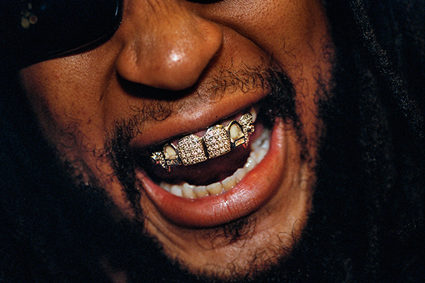 Lauren Greenfield, Lil Jon, 33, sporting a diamond and platinum grill that reportedly cost $50,000, at the 2004 Soul Train Awards, Los Angeles. Lil Jon is a rapper, producer, and DJ who has worked with Snoop Dogg, Ice Cube, Usher, and Britney Spears, 2004 © the artist and courtesy INSTITUTE 