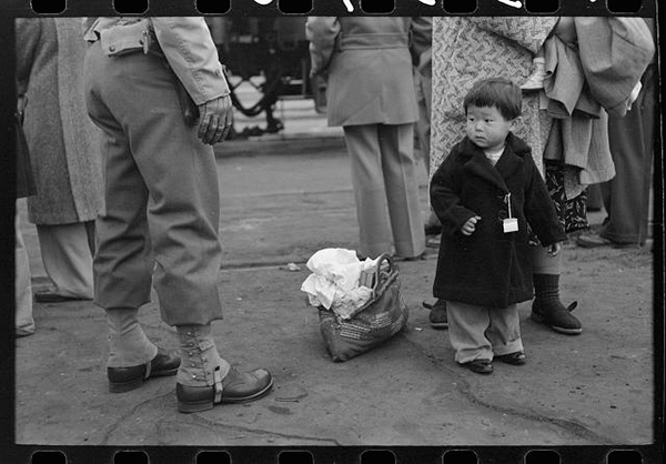 Russell Lee, Los Angeles, California. Japanese-American evacuation from West Coast areas under U.S. Army war emergency order. Japanese-American child who will go with his parents to Owens Valley, 1942 Courtesy the Library of Congress