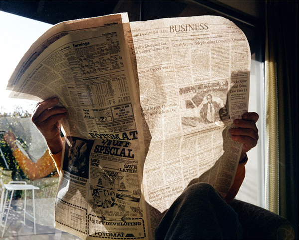 Larry Sultan, Business Page, 1984. Man holding newspaper.