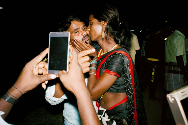 Color photograph of two figures in India