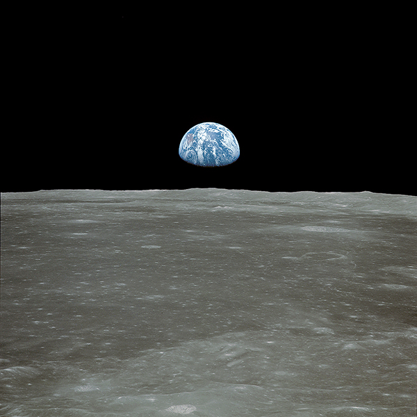A photo of the earth "rising" above the horizon of the moon.