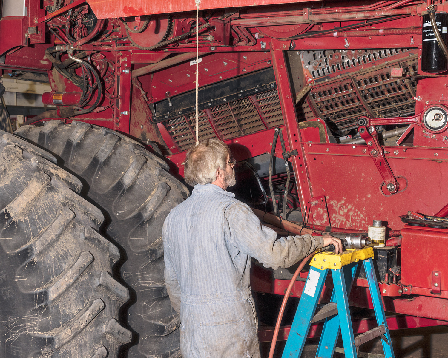 Man in front of tractor machine