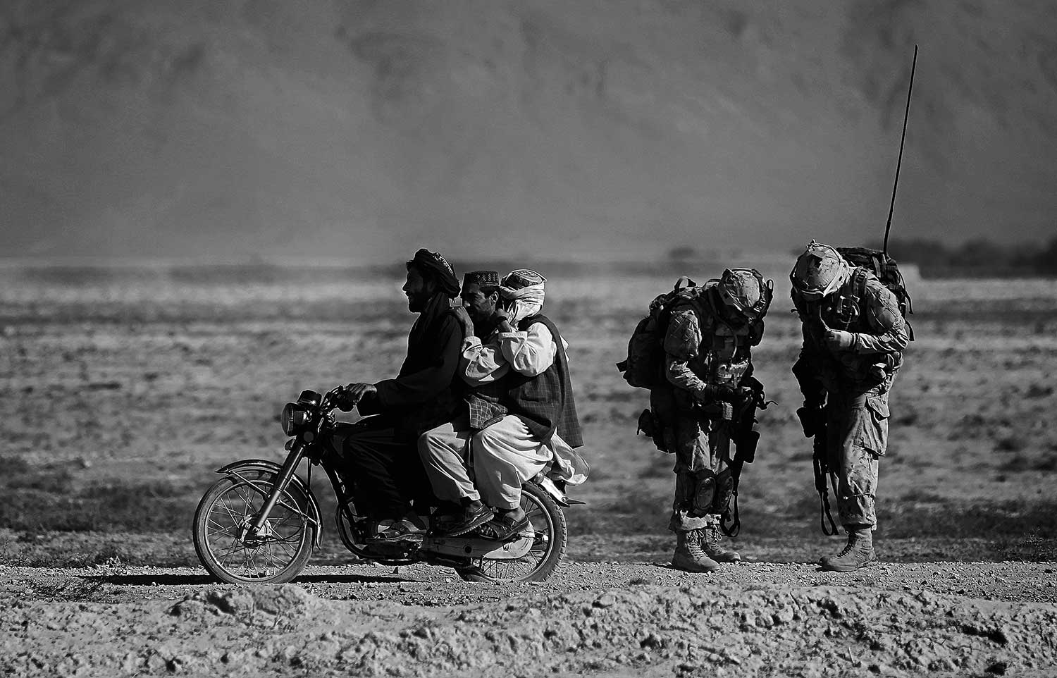 Anja Niedringhaus, Afghan men on a motorcycle, 2010