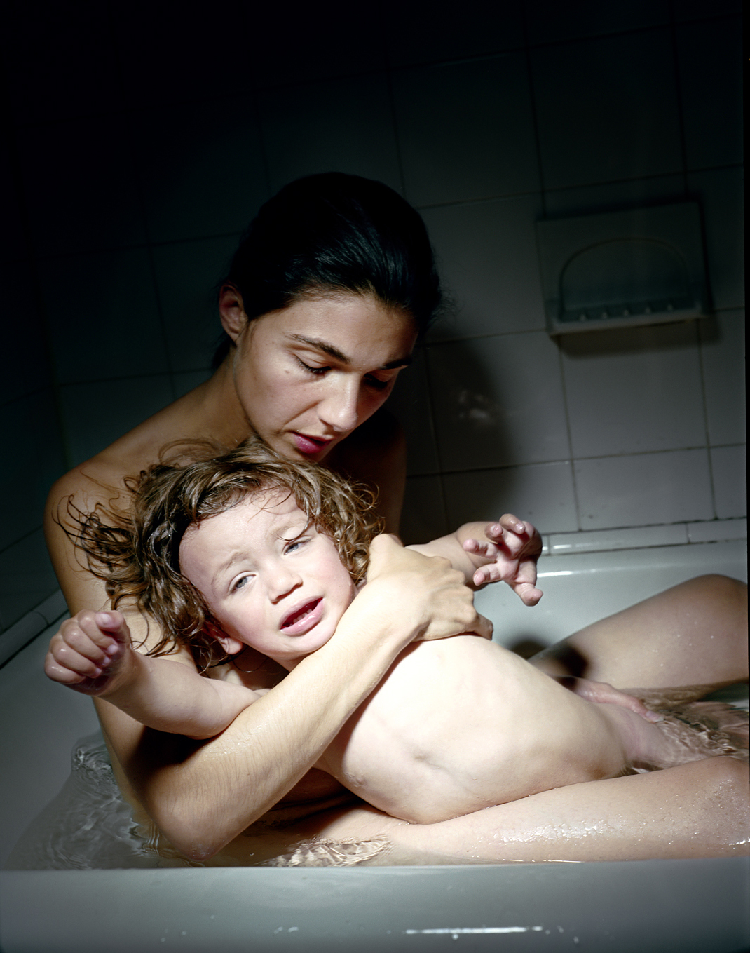 Elinor Carucci in bath with child