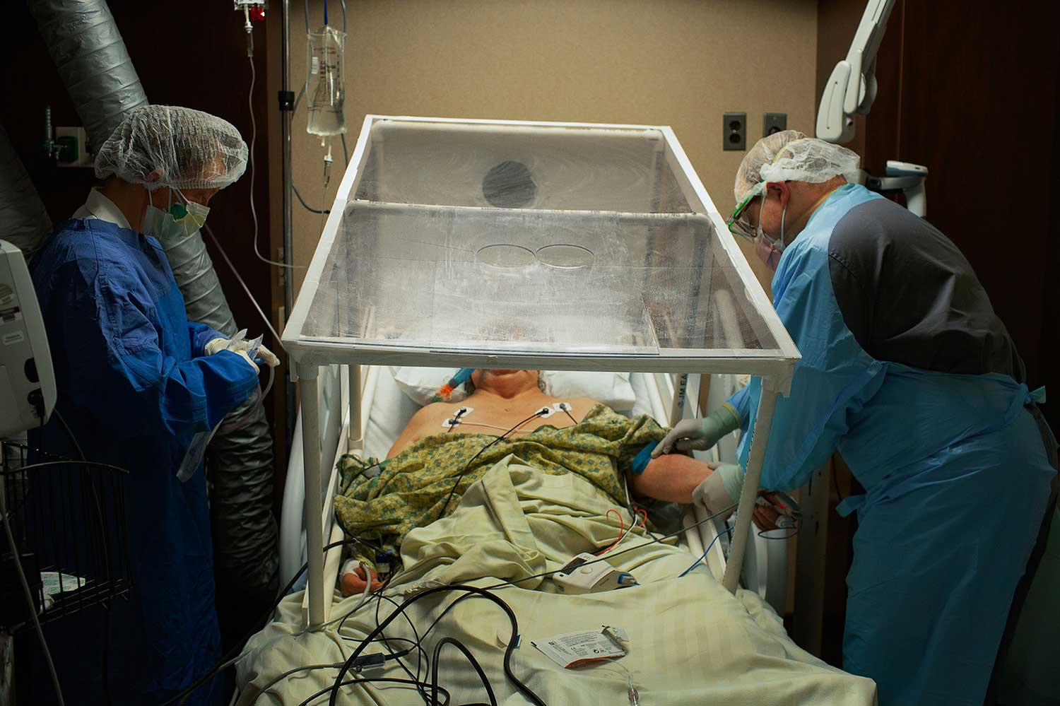 A COVID-19 positive patient being prepared to be intubated. Photo by Danny Kim