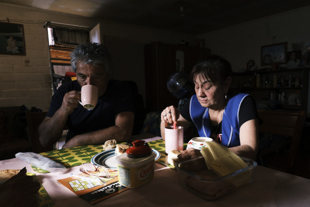 San Bernardo, Santiago, Chile, 2020. Paula Lorca’s parents, Ramón and Maria, drink coffee with the family.