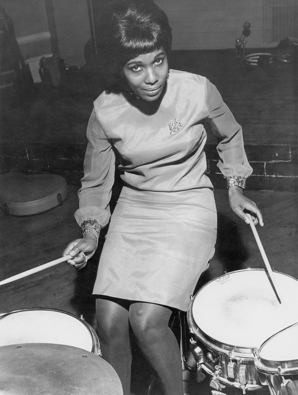 James Barnor, Constance Mulondo at London University with the band The Millionaires, published inc <em>Drum</em> magazine, London, 1967″>
		</div>
		<div class=