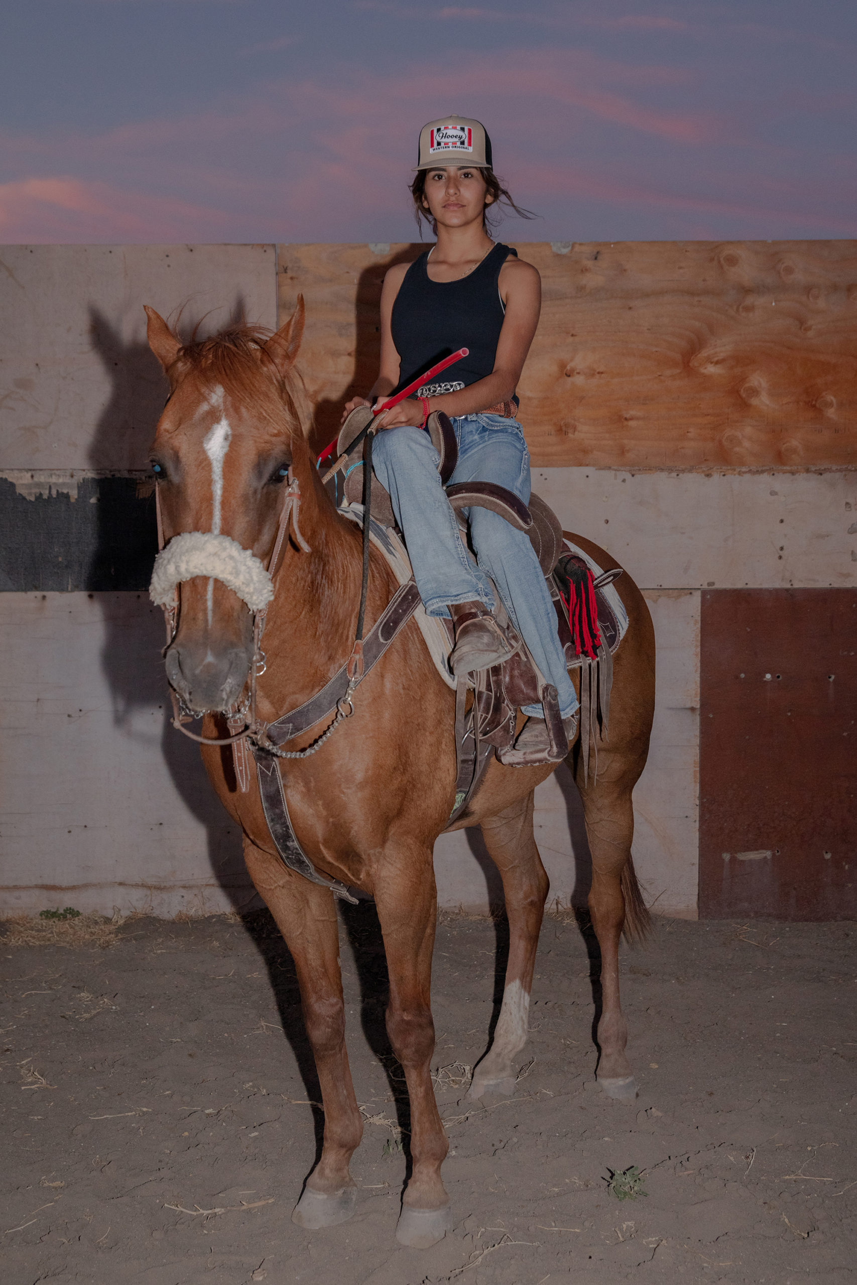 Natalie Keyssar, <em>Marissa Regla poses for a portrait on her horse after practice</em>, French Camp, California, 2021<br/>Courtesy the artist “>
		</div>
		<div class=