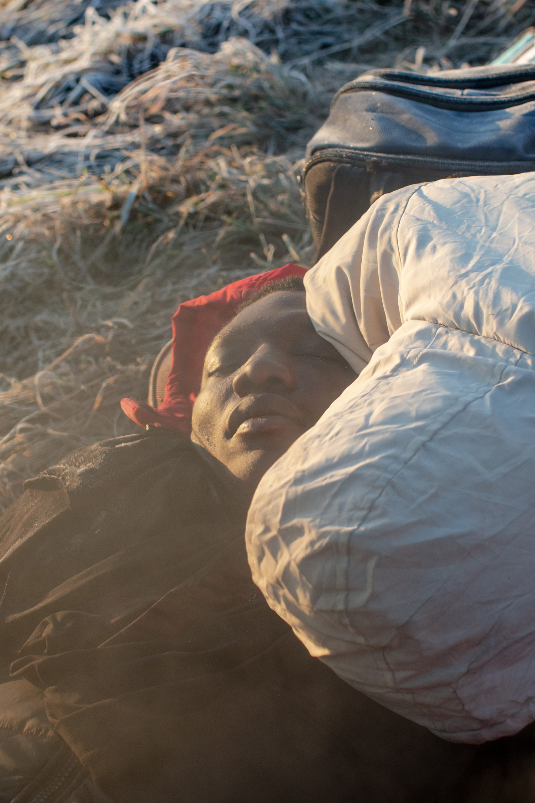 Natalie Keyssar, Refugees sleep on the cold ground on the Polish side of the Medyka crossing, March 1, 2022, for <em>Time</em>“>
		</div>
		<div class=