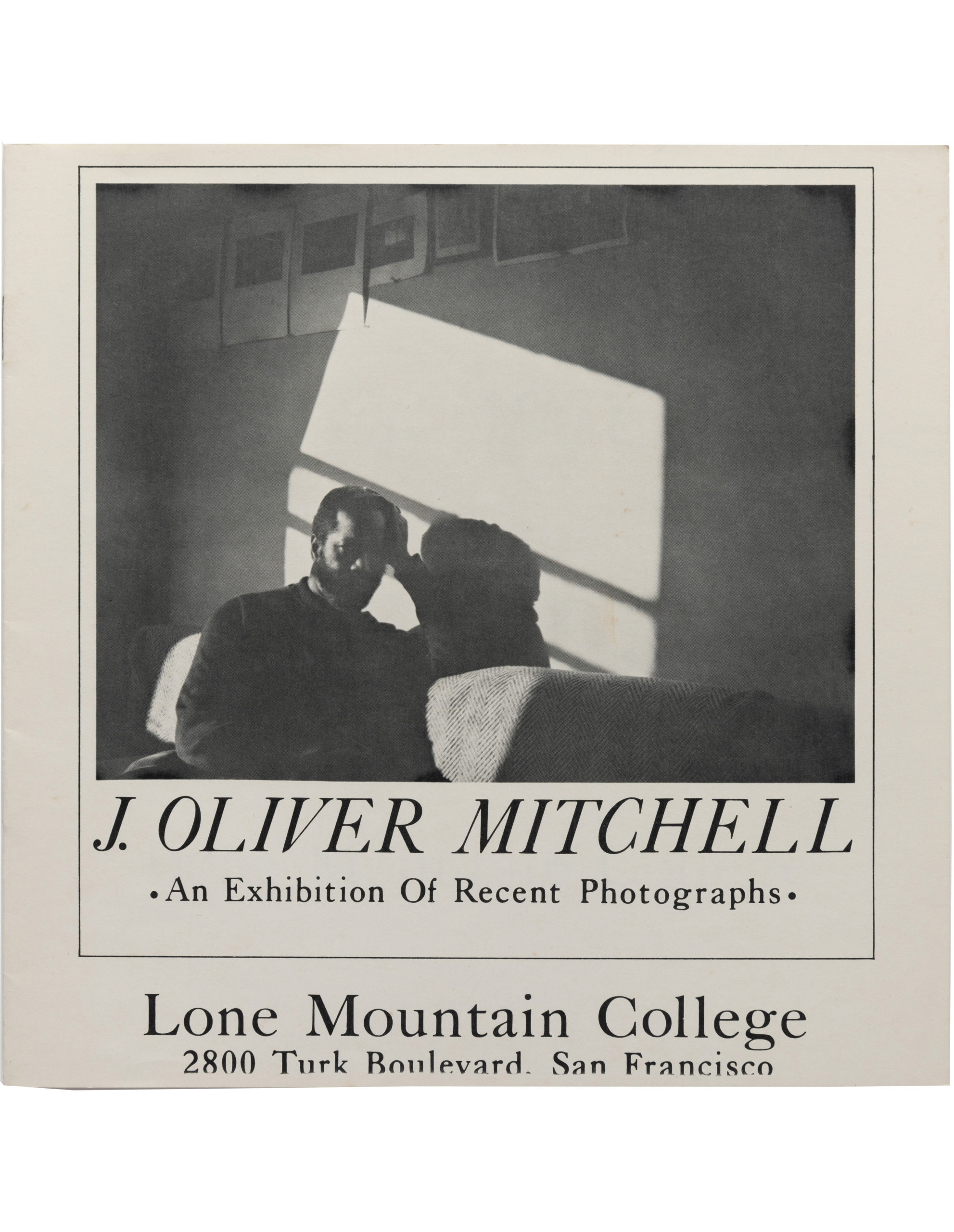 Mitchell's self-portrait on the cover of <em>J. Oliver Mitchell: An Exhibition of Recent Photographs</em> (Lone Mountain College, 1973)”>
		</div>
		<div class=