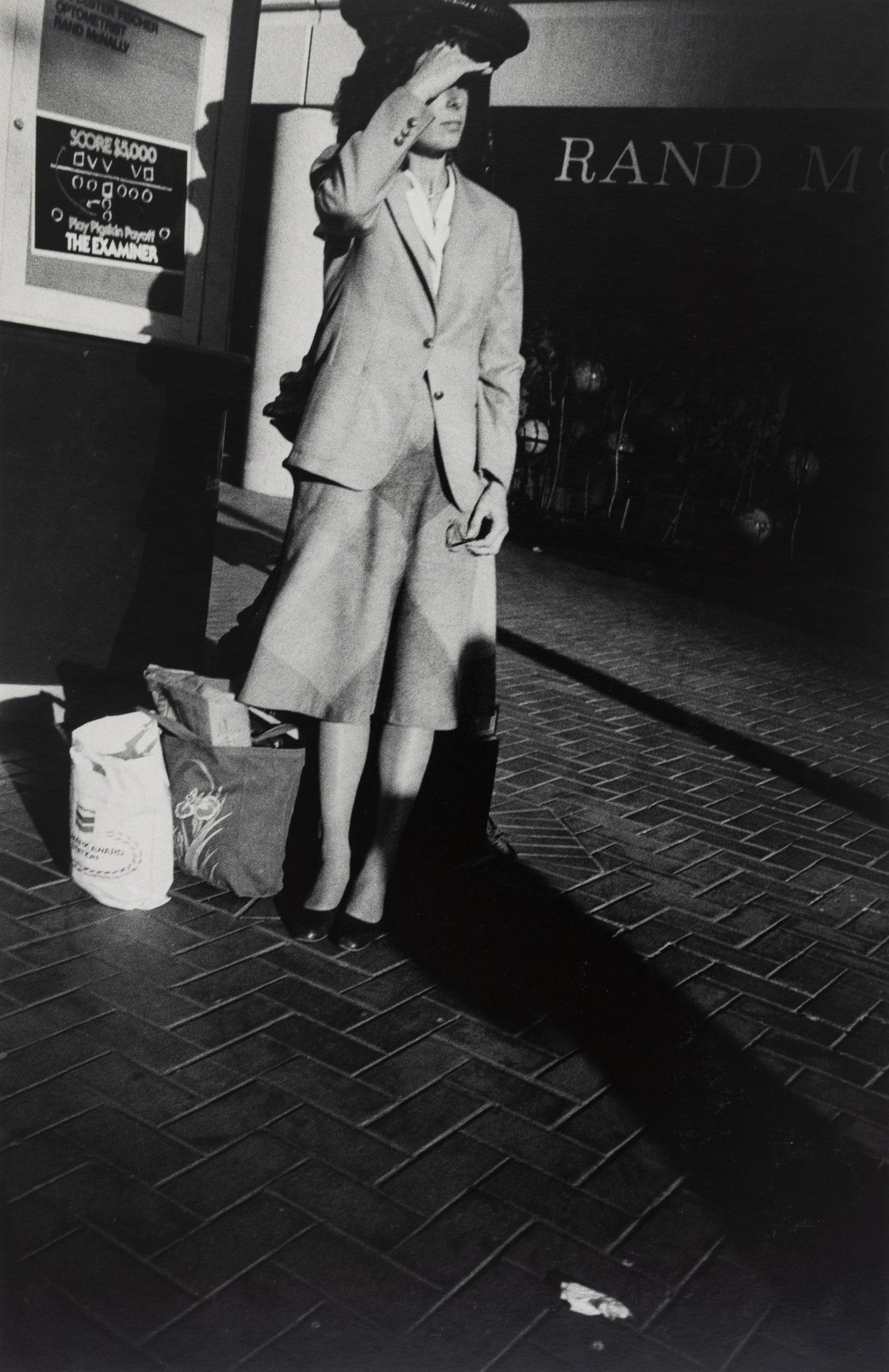 James O. Mitchell, Woman with Bags, San Francisco, 1986