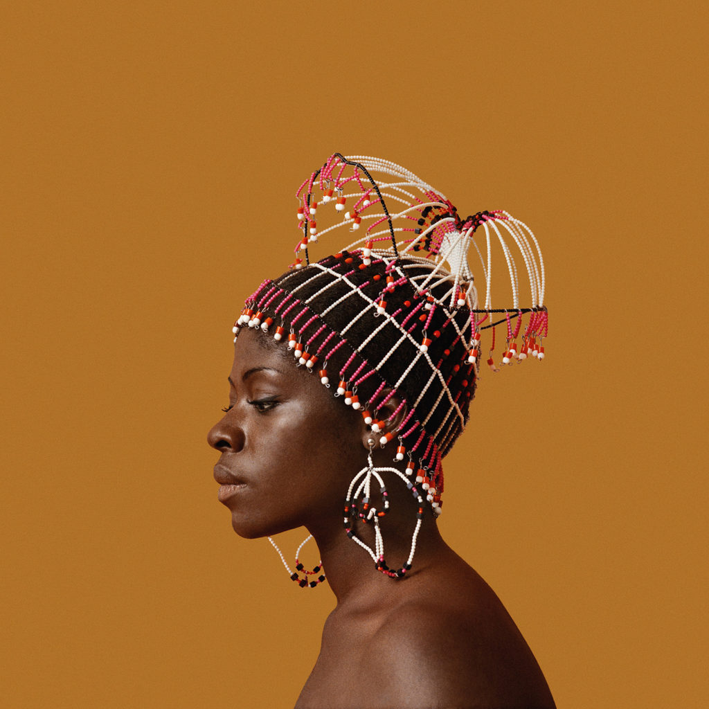 Kwame Brathwaite, Sikolo Brathwaite wearing a headpiece designed by Carolee Prince, African Jazz-Art Society &amp; Studios (AJASS), Harlem, ca. 1968; from Kwame Brathwaite: Black Is Beautiful (Aperture, 2019)