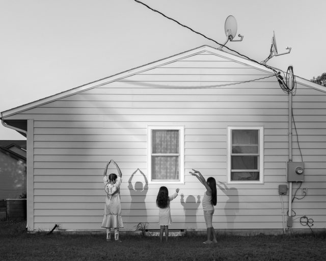 Girls playing with their shadows