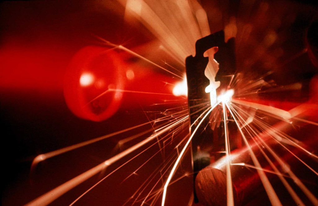 Fritz Goro, Red laser light focused through a lens blasts a pin‑point hole through a razor blade in a thousandth of a second, 1962