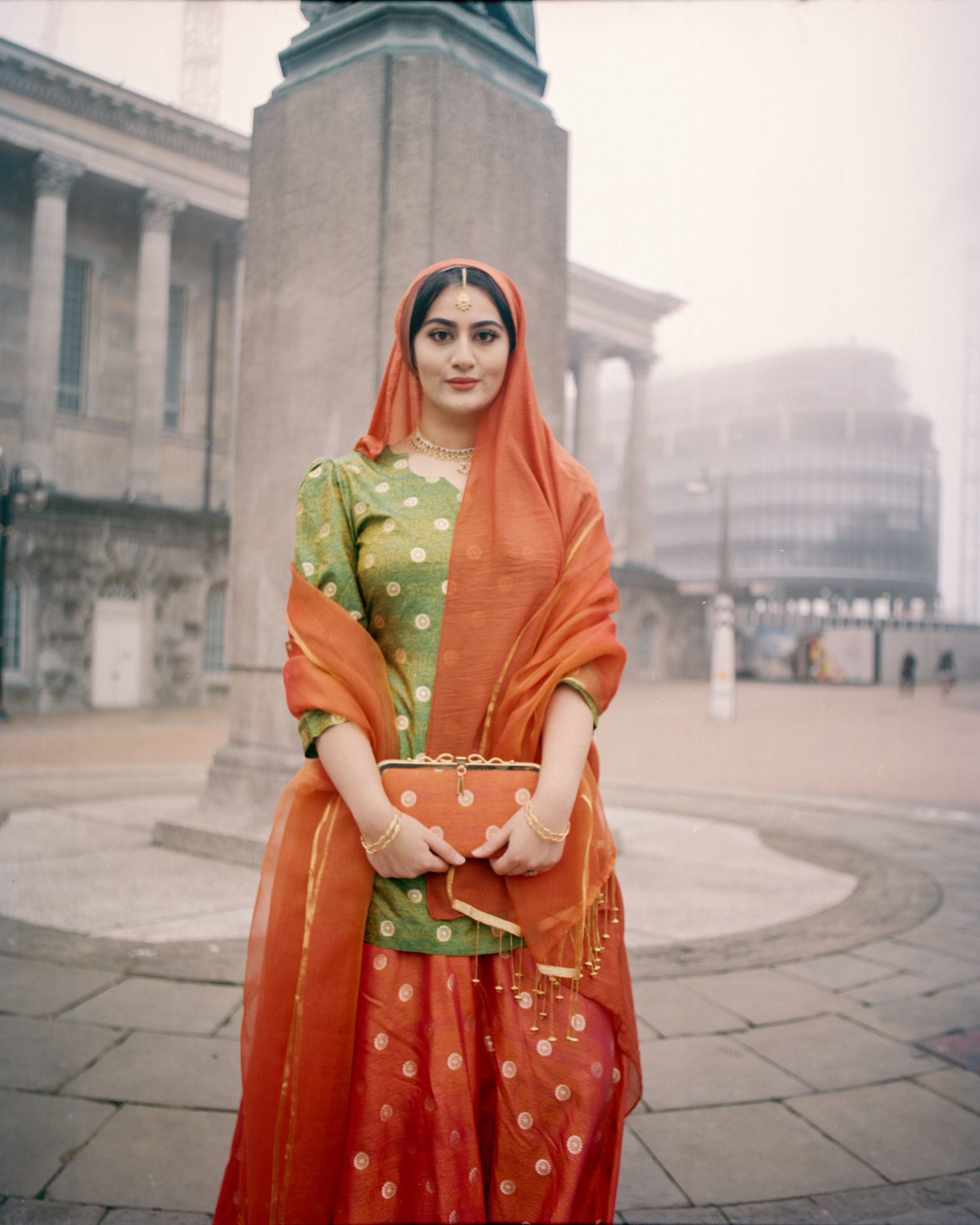 Maryam Wahid, <em>The orange lehenga, near the Queen Victoria Statue in Birmingham</em>, 2018, from the series <em>Women from the Pakistani Diaspora in England</em>, 2018–ongoing
“>
		</div>
		<div class=