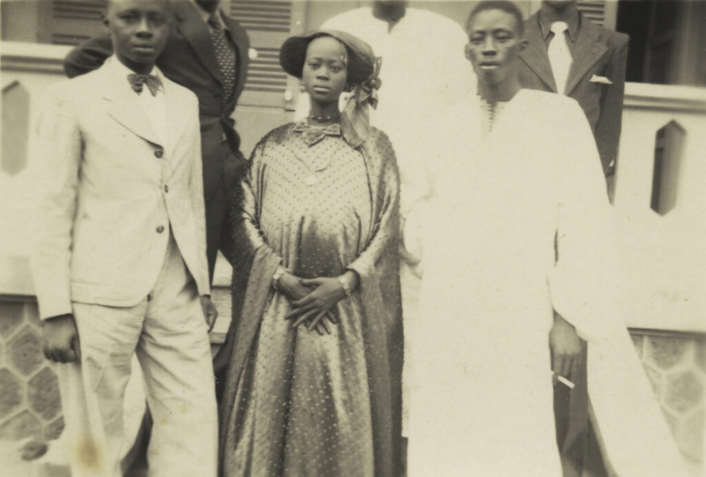 black and white portrait of five Senegalese people in suits and robes