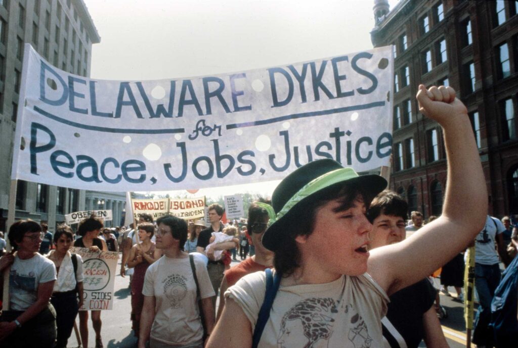 A color photo of women marching in a queer pride parade