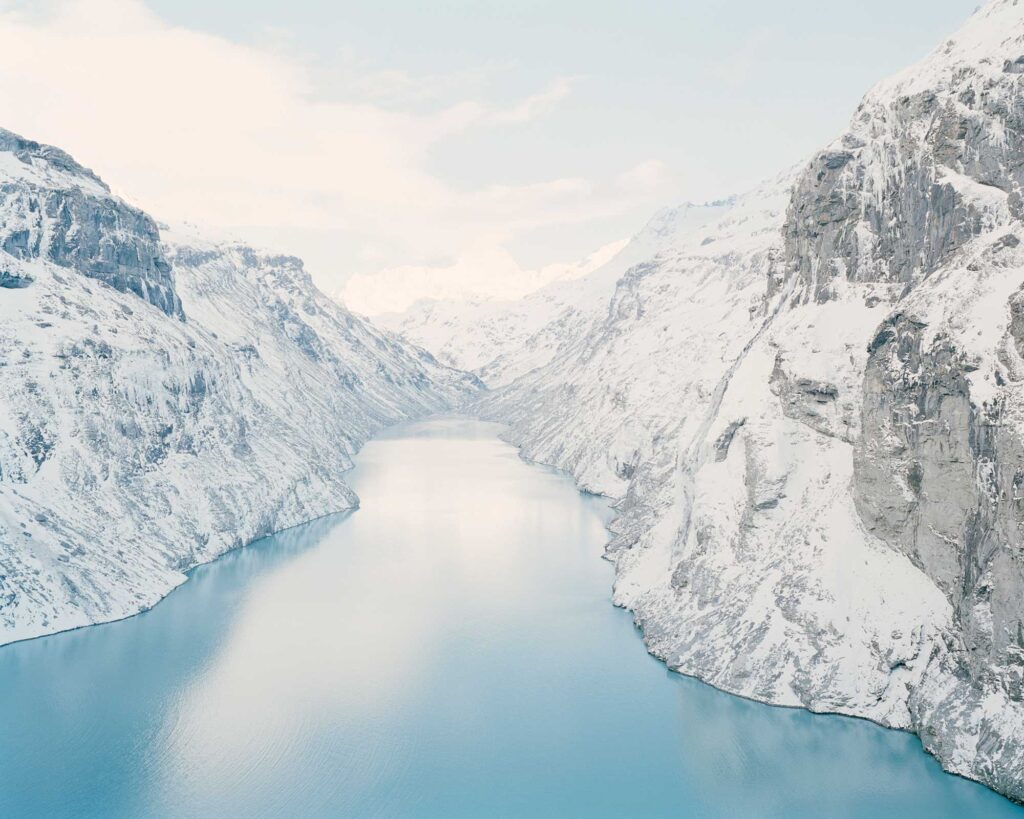 Color photograph of mountains and lake in Switzerland