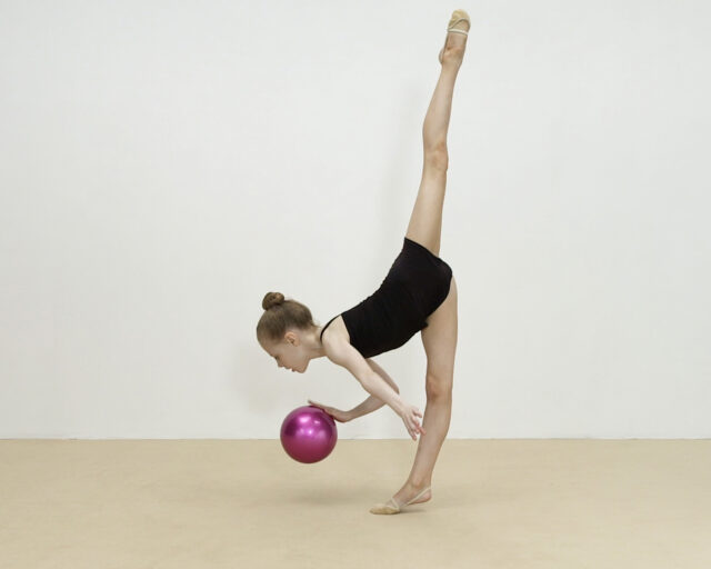 Video still of a young girl in a ballet pose