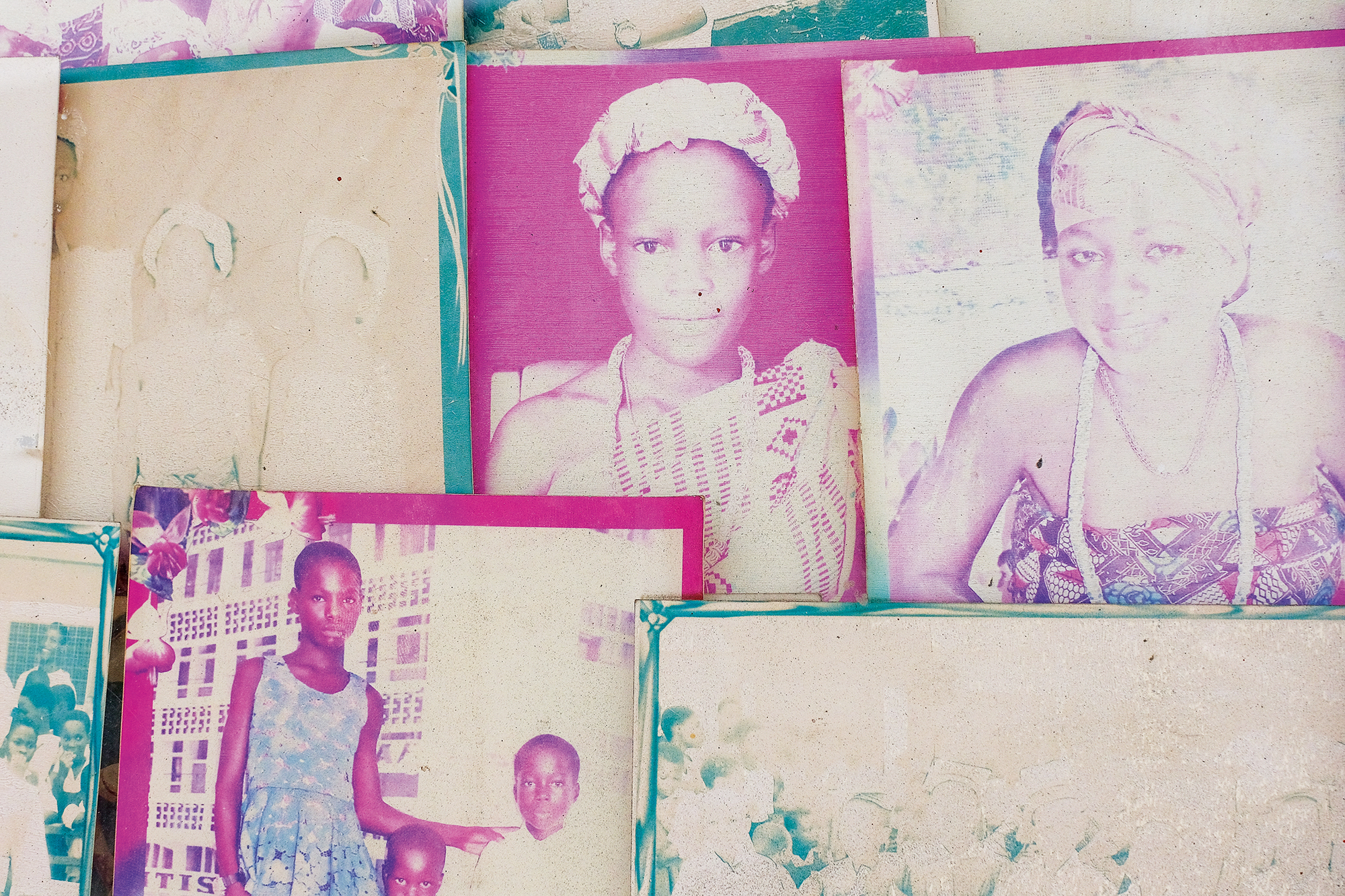 Color prints are displayed at the entrance of the Deo Gratias studio, Ghana's oldest operating photography studio established in 1922, in Jamestown, Accra, Ghana. April 21, 2023. Photo: Francis Kokoroko