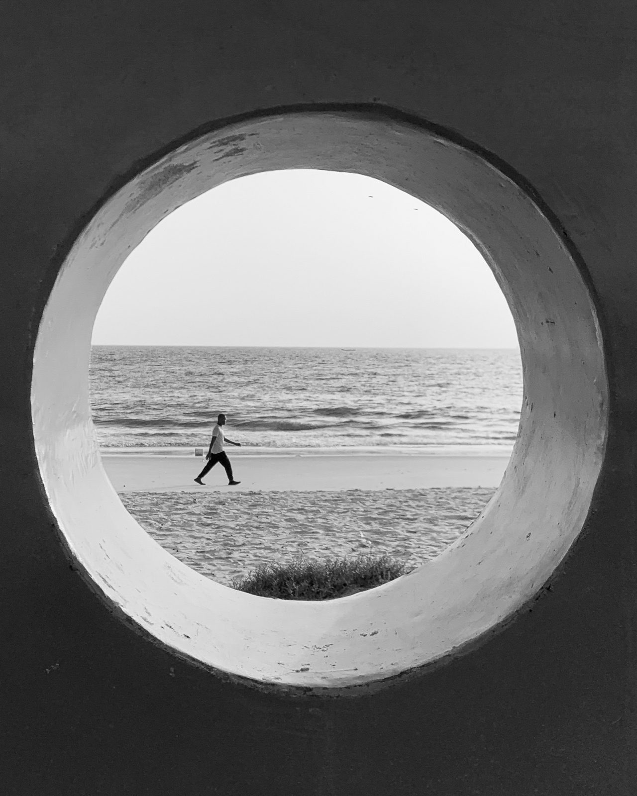 Abdul Hamid Kanu Jr., A man walking on Lumley Beach, Freetown, 2022