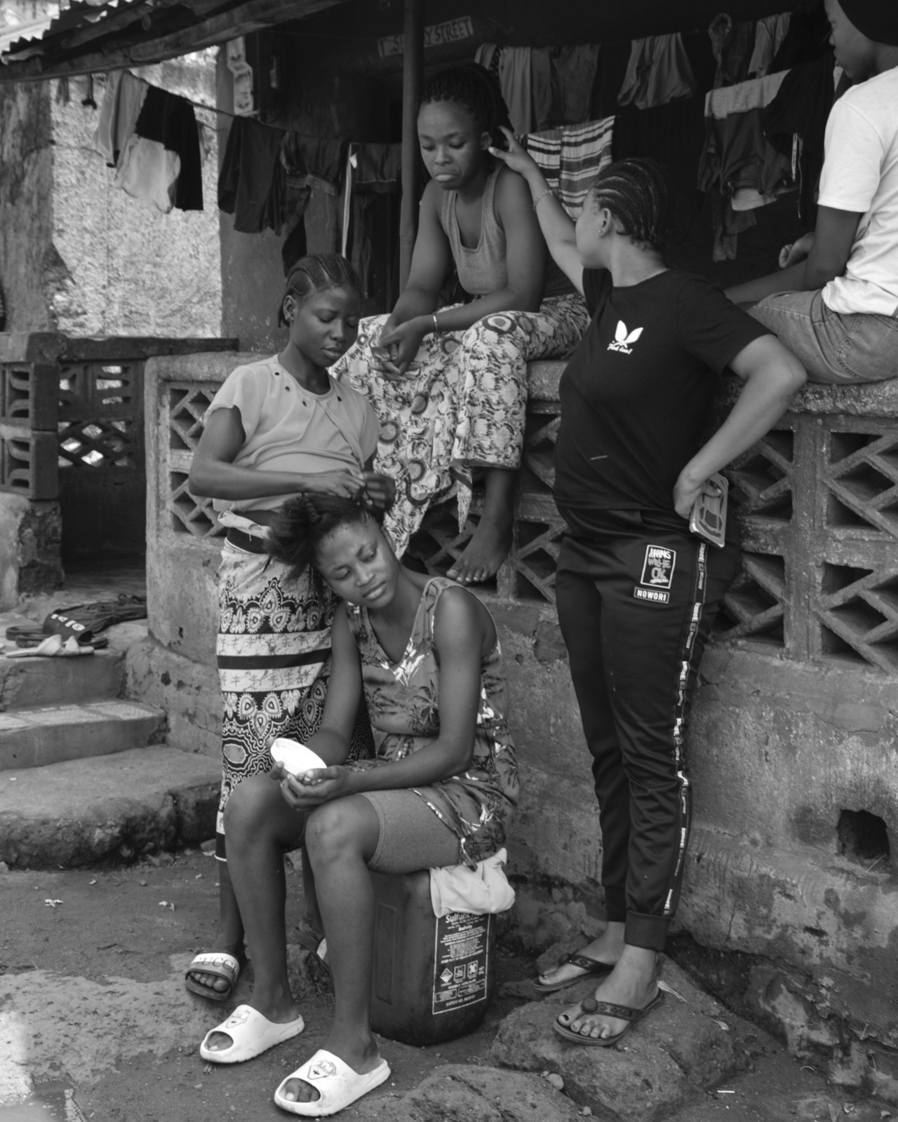 Abdul Hamid Kanu Jr., A girl getting braids for school, Calaba Town, Freetown, 2022