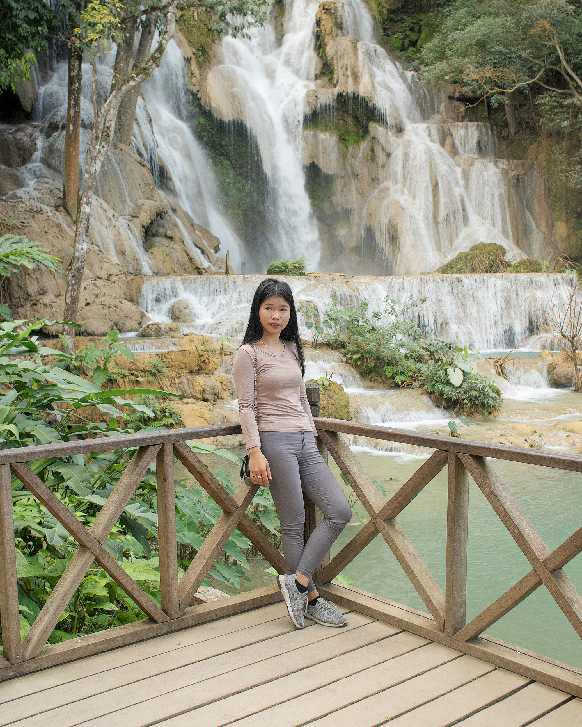 Pao Houa Her, <em>Untitled (portrait of a woman in gray by a waterfall)</em>, 2019, from the series <em>The Imaginative Landscape</em>“>
		</div>
		<div class=