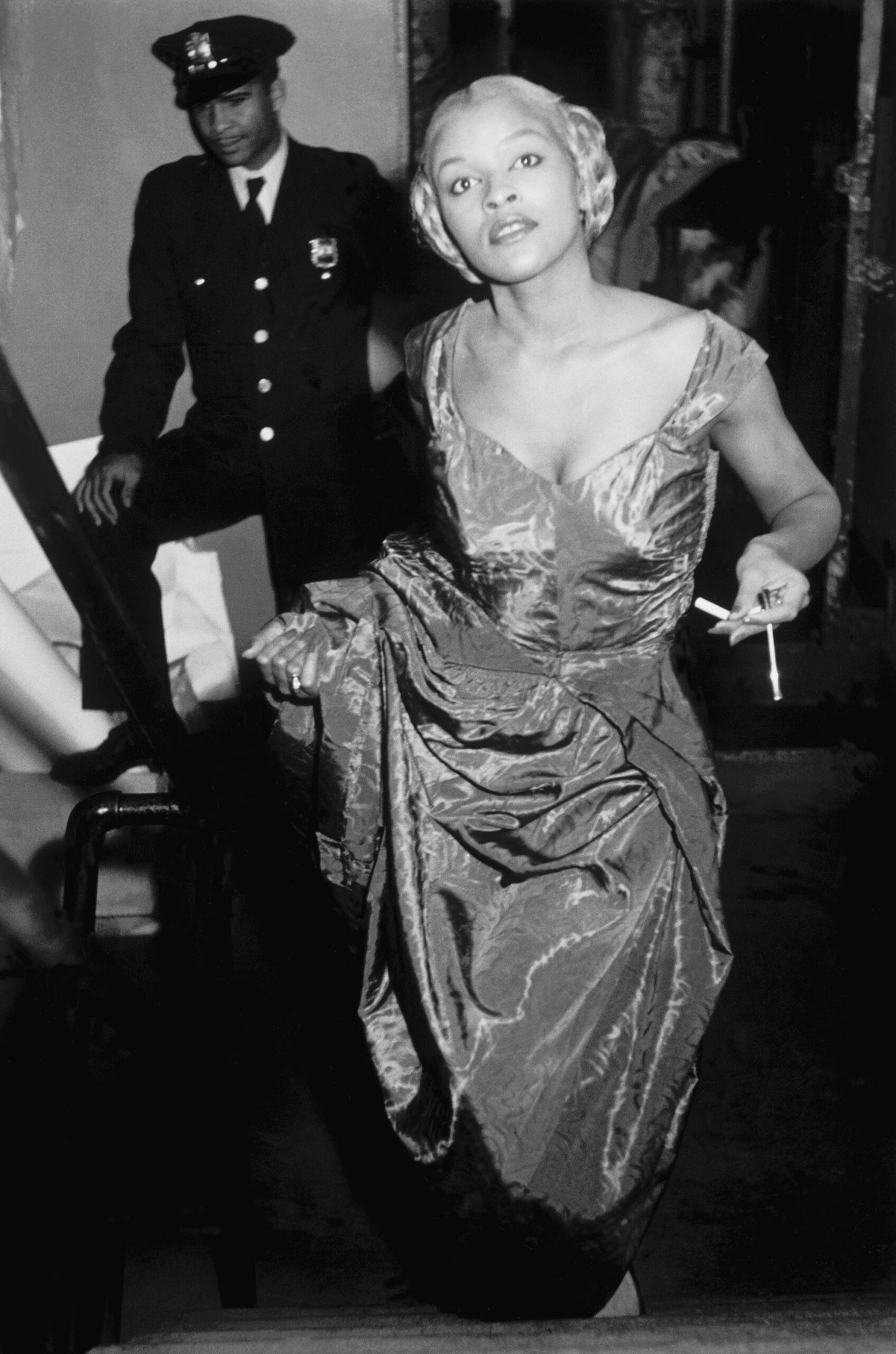 USA. New York City. Fashion in Harlem. Model Charlotte Stribling aka 'Fabulous' waits backstage for the entrance cue to model clothes designed and made in the Harlem community. The venue is the Abyssinian Church. 1950.