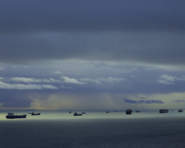 Cargo ships out on the ocean.