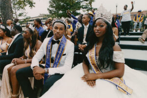 A young, black homecoming king and queen.
