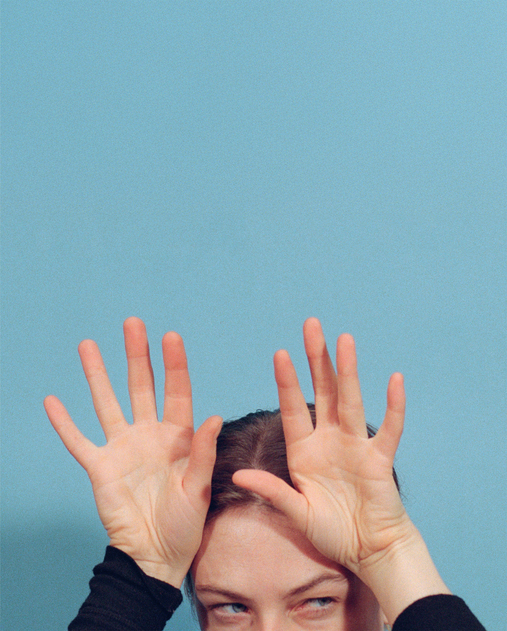 Polly Brown, <em>Stag Do</em>, from the series <em>Secret
Gestures</em>, 2026. 
Airline stewardesses’
secret signal for “bachelor
party onboard”<br>Cover of <em>Aperture</em> No. 263, “Secrets”