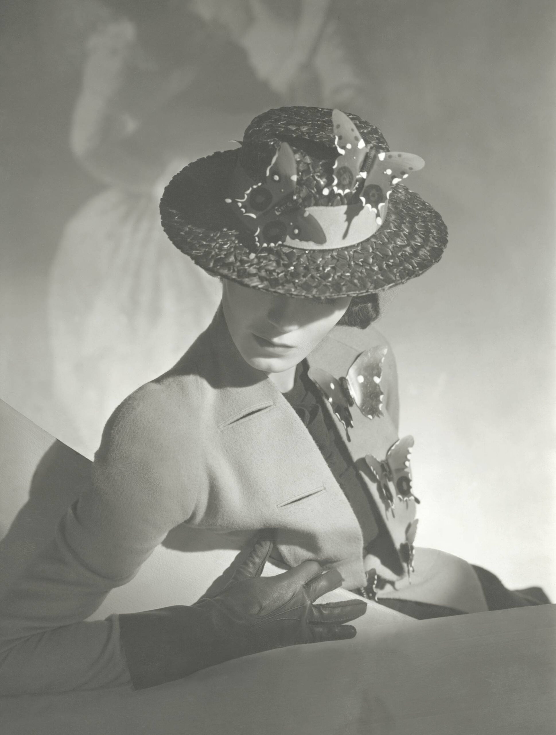 Horst P. Horst, Collarless jacket and hat with butterfly trimmings, <em>British Vogue</em>, March 15, 1937<br>Courtesy Condé Nast via Getty Images”>
		</div>
		<div class=
