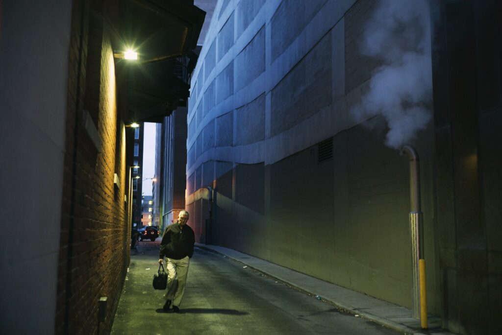Indianapolis.  Downtown early morning.  East side -- Slavadoran laborer waiting for work